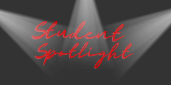 The image features the words "Student Spotlight" in red text with spotlights shining down on a dark background.